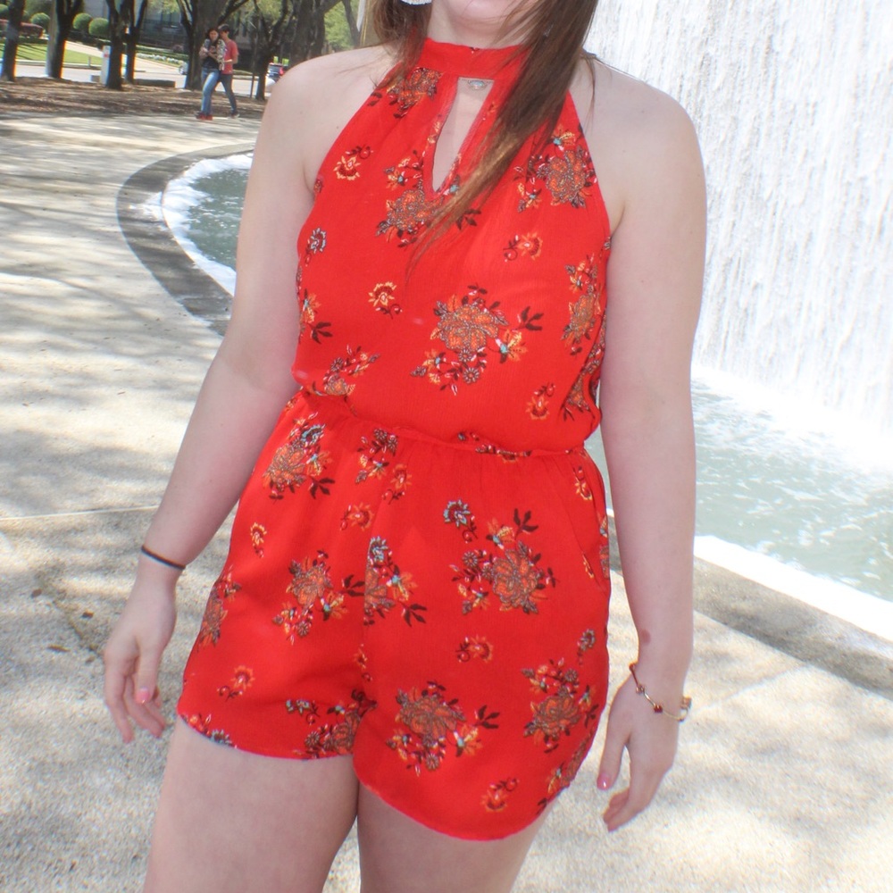 red romper with flower detailing